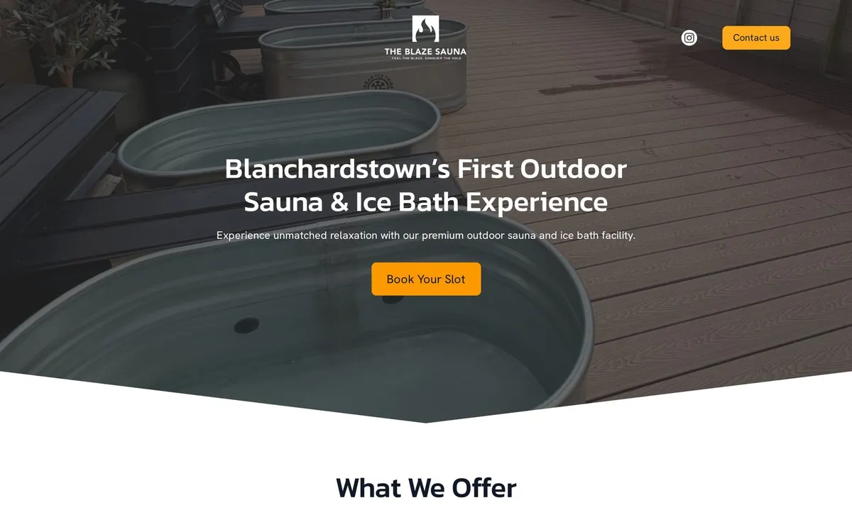 The Blaze Sauna website shown on a laptop